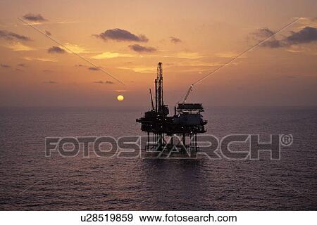 Stock Photo - Offshore Production Platform at Sunset. Fotosearch