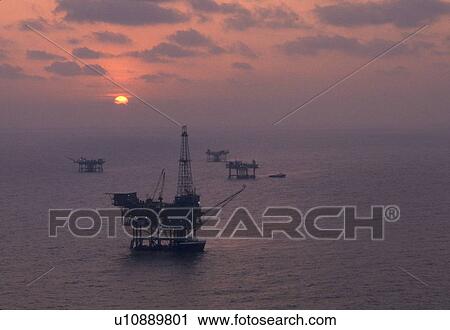 Offshore Production Platforms at Sunset View Large Photo Image Stock Image - Offshore Production Platforms at Sunset. Fotosearch