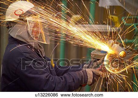 Oil Refinery Worker Grinding Pipe View Large Photo Image Stock Photograph - Oil Refinery Worker Grinding Pipe. Fotosearch