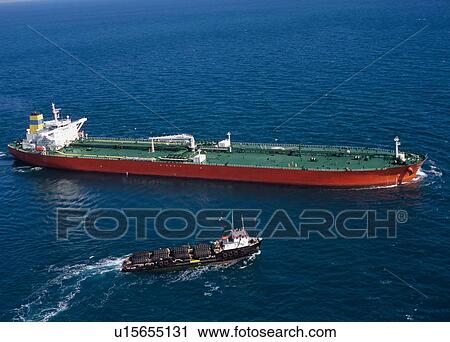 Stock Image - Oil Tanker and Supply Boat. Fotosearch