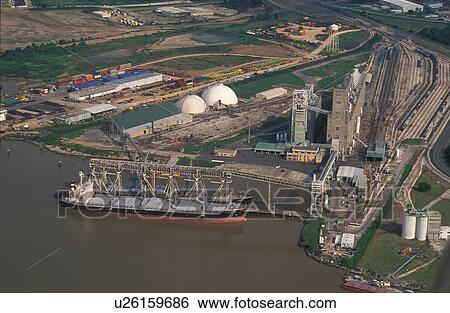 Stock Photograph - Oil Tanker Offloading at Oil Storage Facility. Fotosearch