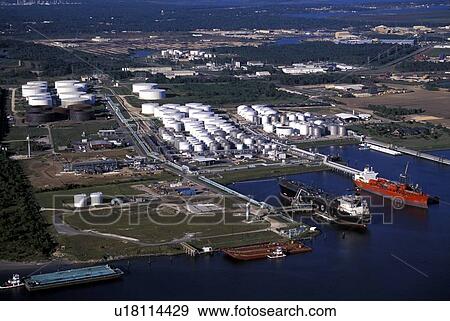 Stock Photo - Oil Tankers Offloading at Oil Storage Facility. Fotosearch