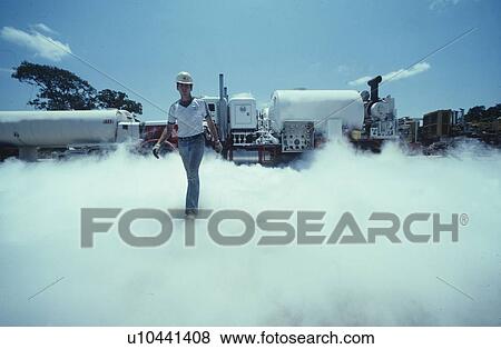 Oilfield Worker Conducting Hydraulic Fracturing Operation View Large Photo Image Stock Photo - Oilfield Worker Conducting Hydraulic Fracturing Operation. Fotosearch