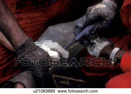 Oilfield Worker Handling Cable View Large Photo Image Stock Photo - Oilfield Worker Handling Cable. Fotosearch