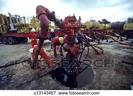 Oilfield Workers, Wellhead Assembly Maintenance View Large Photo Image Stock Photo - Oilfield Workers, Wellhead Assembly Maintenance. Fotosearch