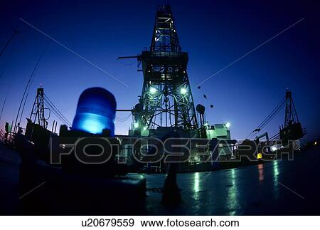 Stock Photo - Onboard Deck of Offshore Oil Drilling Rig at Night. Fotosearch