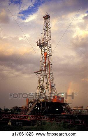 Stock Image - Onshore Oil Drilling Rig and Rainbow. Fotosearch