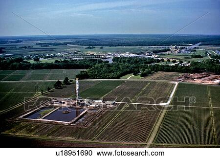 Onshore Oil Drilling Rig in Farmland View Large Photo Image Stock Image - Onshore Oil Drilling Rig in Farmland. Fotosearch