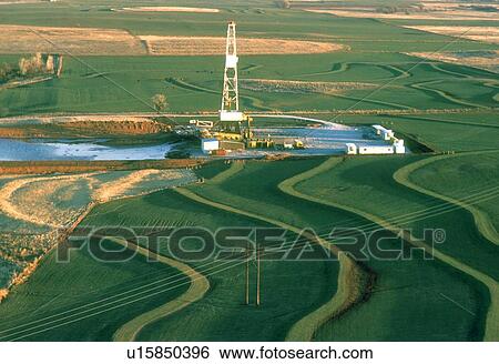 Stock Photograph - Onshore Oil Drilling Rig in Farmland. Fotosearch