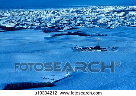 Onshore Oil Drilling Rig in Mountainous Snow Covered Terrain View Large Photo Image Stock Image - Onshore Oil Drilling Rig in Mountainous Snow Covered Terrain. Fotosearch