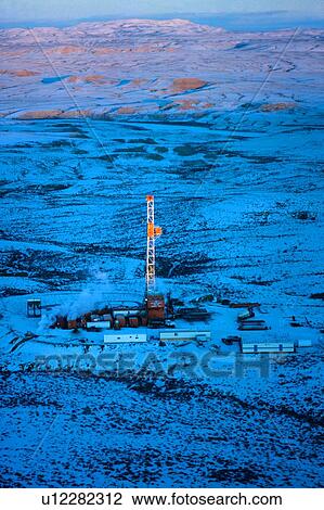 Onshore Oil Drilling Rig in Remote Snow Covered Terrain View Large Photo Image Stock Image - Onshore Oil Drilling Rig in Remote Snow Covered Terrain. Fotosearch