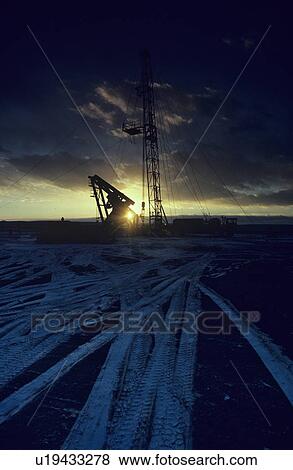 Stock Photo - Onshore Well Site at Sunset. Fotosearch