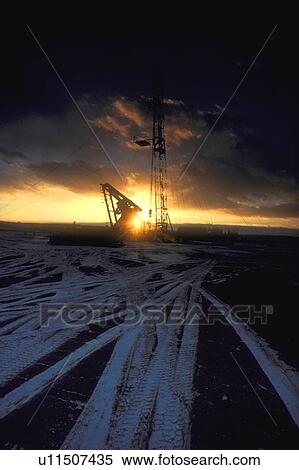 Stock Photography - Onshore Well Site at Sunset. Fotosearch