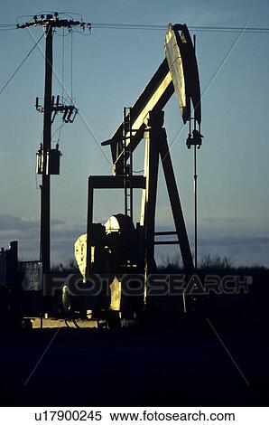 Stock Photography - Pump Jacks and Telephone Pole. Fotosearch