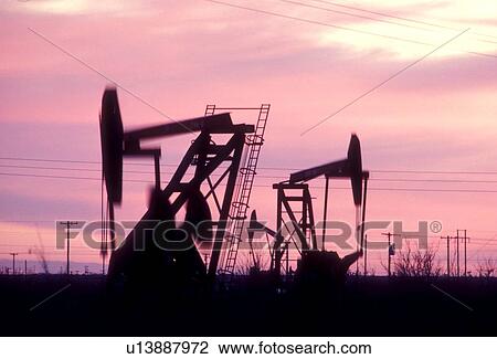 Pump Jacks Operating at Sunset View Large Photo Image Stock Image - Pump Jacks Operating at Sunset. Fotosearch