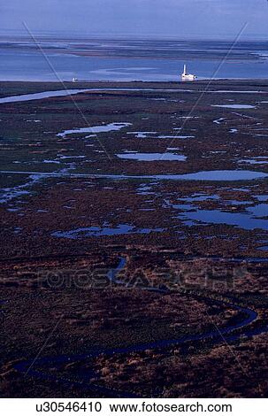 Stock Image - Shallow Water Oil Drilling Barge Operating in Coastal Water. Fotosearch