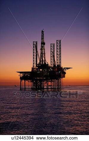 Silhouete of Offshore Oil Drilling Rig at Sunset View Large Photo Image Picture - Silhouete of Offshore Oil Drilling Rig at Sunset. Fotosearch