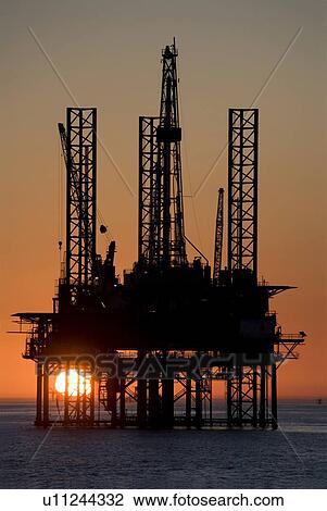 Silhouete of Offshore Oil Drilling Rig at Sunset View Large Photo Image Stock Image - Silhouete of Offshore Oil Drilling Rig at Sunset. Fotosearch