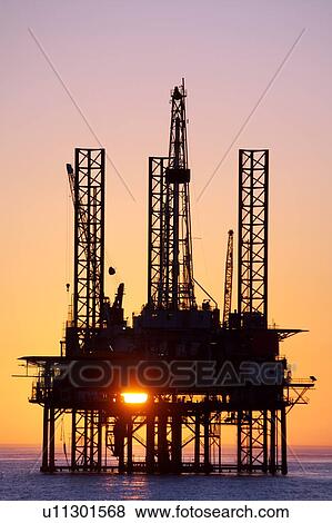 Silhouete of Offshore Oil Drilling Rig at Sunset View Large Photo Image Stock Photo - Silhouete of Offshore Oil Drilling Rig at Sunset. Fotosearch