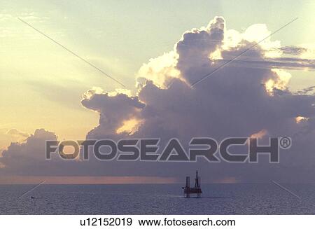 Silhouete of Offshore Oil Drilling Rig at Sunset View Large Photo Image Stock Photo - Silhouete of Offshore Oil Drilling Rig at Sunset. Fotosearch
