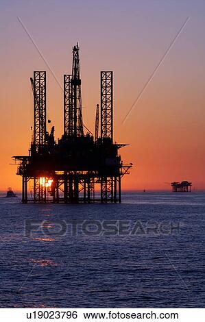 Silhouete of Offshore Oil Drilling Rig at Sunset View Large Photo Image Stock Photograph - Silhouete of Offshore Oil Drilling Rig at Sunset. Fotosearch