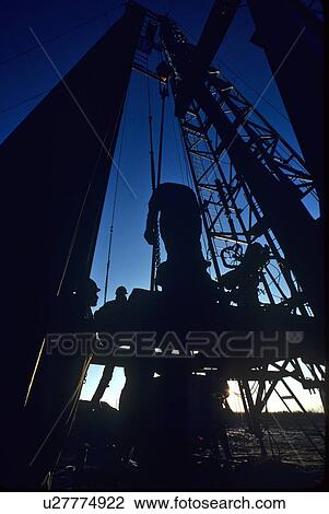 Silhouette o Oilfield Worker at Drilling Site View Large Photo Image Stock Image - Silhouette o Oilfield Worker at Drilling Site. Fotosearch