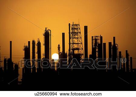 Picture - Silhouette of Oil Refinery at Sunset. Fotosearch