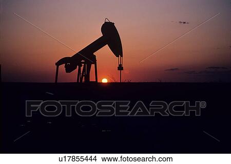 Silhouette of Pump Jack Operating at Sunset View Large Photo Image Picture - Silhouette of Pump Jack Operating at Sunset. Fotosearch