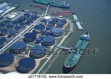 Two Oil Tankers Offloading at Oil Storage Facility with Blue Tanks View Large Photo Image Stock Image - Two Oil Tankers Offloading at Oil Storage Facility with Blue Tanks. Fotosearch