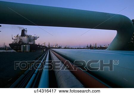 Stock Photo - View of Oil Tanker with Pipeline in Foreground. Fotosearch