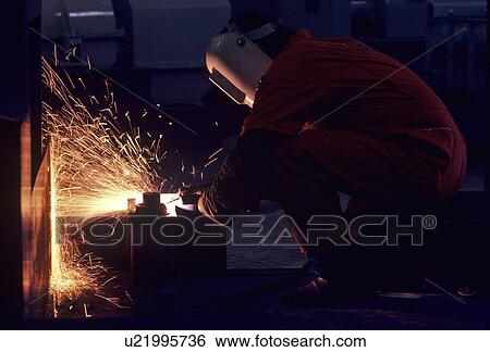 Welder Working at Well Site View Large Photo Image Stock Photograph - Welder Working at Well Site. Fotosearch