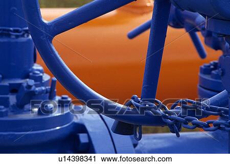 Stock Image - Wellhead Valve Chained. Fotosearch