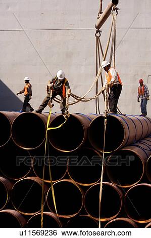 Workers Offloading Pipe from Cargo Ship View Large Photo Image Stock Photograph - Workers Offloading Pipe from Cargo Ship. Fotosearch