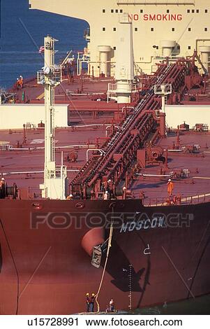 Workers Securing Rope on Oil Tanker View Large Photo Image Stock Image - Workers Securing Rope on Oil Tanker. Fotosearch