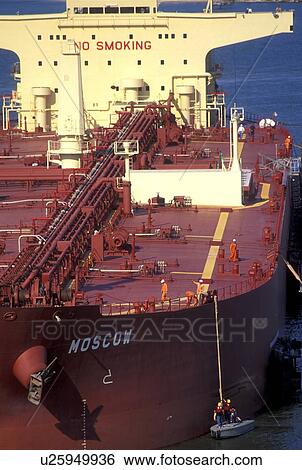 Workers Securing Rope on Oil Tanker View Large Photo Image Stock Photograph - Workers Securing Rope on Oil Tanker. Fotosearch