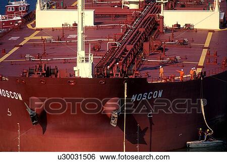 Workers Securing Rope on Oil Tanker View Large Photo Image Stock Photograph - Workers Securing Rope on Oil Tanker. Fotosearch
