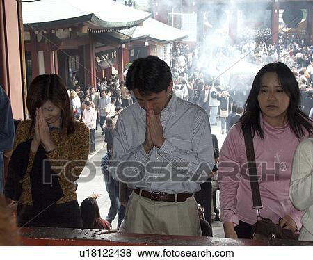 Stock Photo - asakusa, people, praying, japan, person, love. Fotosearch