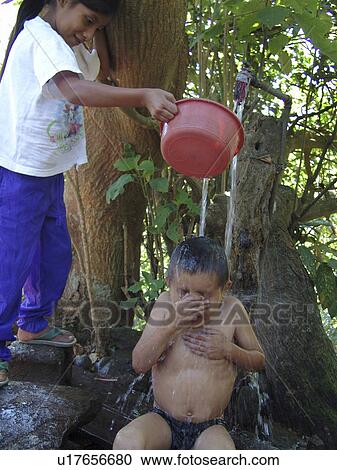 bath, person, taking, boy, honduras, people View Large Photo Image Stock Image - bath, person, taking, boy, honduras, people. Fotosearch