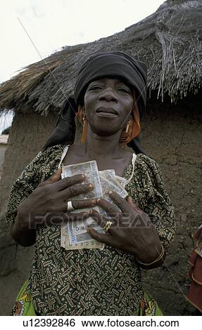 Stock Photograph - benin, people, 7571, person, money, business. Fotosearch
