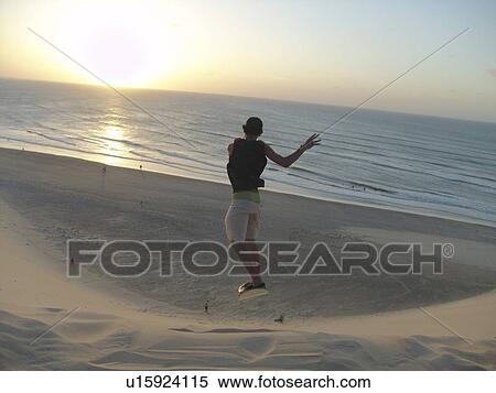 Stock Photography - boy, people, brazil, person, sport, beach. Fotosearch
