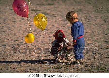 Stock Photography - boys, people, two, children, sport, beach. Fotosearch