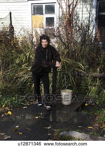 Stock Photograph - collecting, water, russia, person, people, woman. Fotosearch