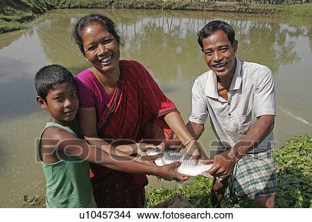 fish, woman, child, people, food, family View Large Photo Image Picture - fish, woman, child, people, food, family. Fotosearch