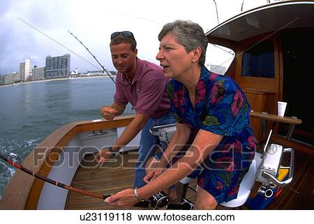 Stock Photo - fishing, laughing, family, fishermen, successful, happy. Fotosearch