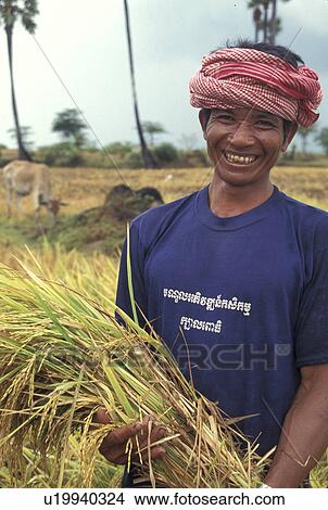 holding, person, takeo, farmer, cambodia, people View Large Photo Image Picture - holding, person, takeo, farmer, cambodia, people. Fotosearch