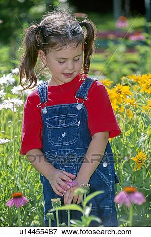 Stock Photo - images, kid, flowers, girl, young, child. Fotosearch