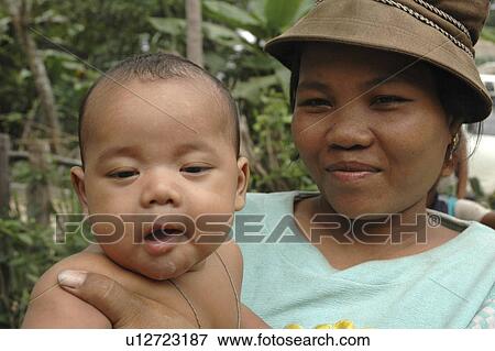 Stock Photo - kampong, people, mother, cambodia, person, baby. Fotosearch