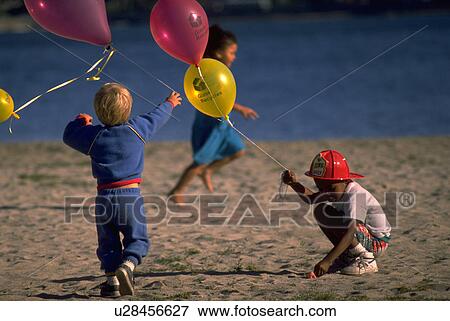 Stock Photo - kids, people, children, sport, girl, beach. Fotosearch
