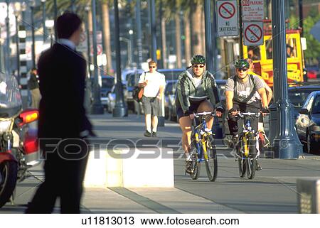 male, cyclists, sidewalk, approaches, business View Large Photo Image Stock Image - male, cyclists, sidewalk, approaches, business. Fotosearch
