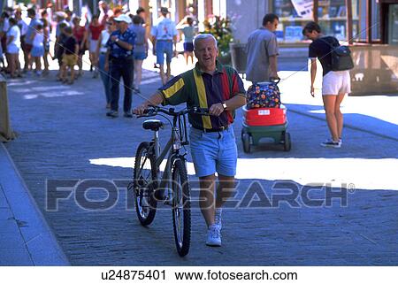 Stock Image - male, down, bicycle, walking, family. Fotosearch